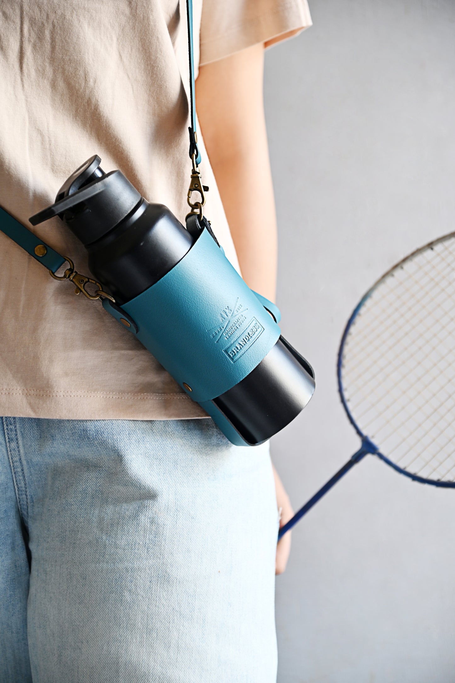 Handcrafted leather bottle carrier with crossbody & hand strap