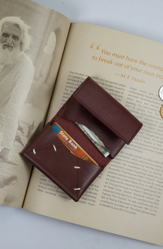 Card Holder is a quintessential accessory in today's fast paced life. Handcrafted in leather, it allows you to keep your cards and a small amount of cash in its folds. You can easily carry the Card Holder in your hand or keep it in your pocket.