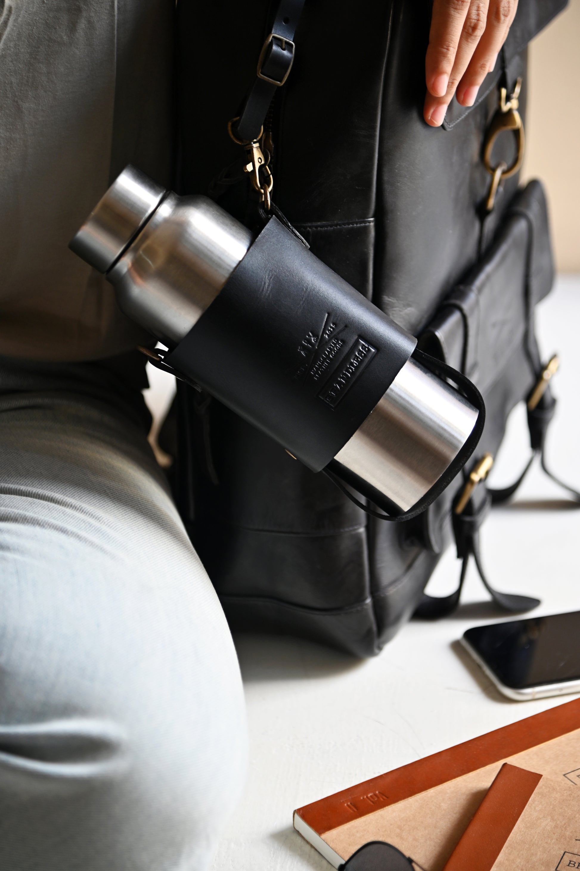 Handcrafted leather bottle carrier with crossbody & hand strap