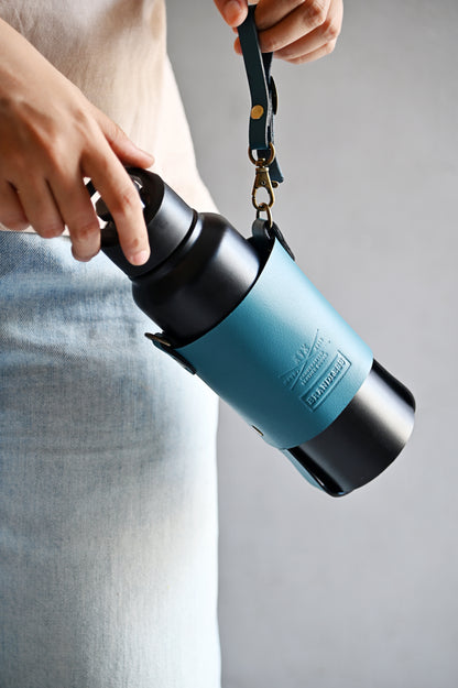 Handcrafted leather bottle carrier with crossbody & hand strap