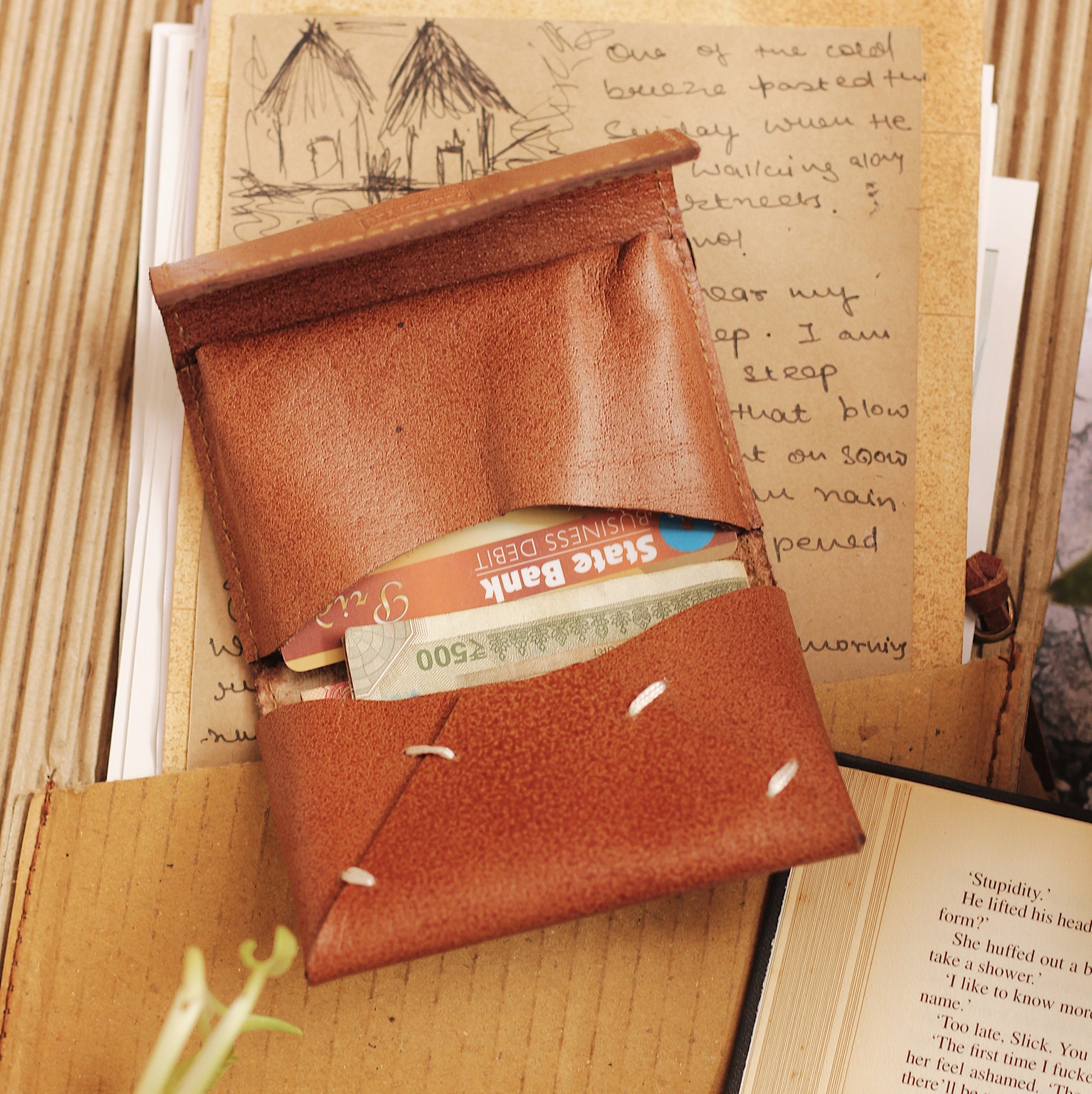 Card Holder is a quintessential accessory in today's fast paced life. Handcrafted in leather, it allows you to keep your cards and a small amount of cash in its folds. You can easily carry the Card Holder in your hand or keep it in your pocket.