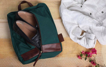 The Shoe Sack is handcrafted in heavy cotton canvas and genuine leather trimmings, which is a great choice for travelers and gym-goers alike. It is a more durable and stylish alternative to flimsy plastic bags or bulky hard cases that take up a lot of space in your luggage.